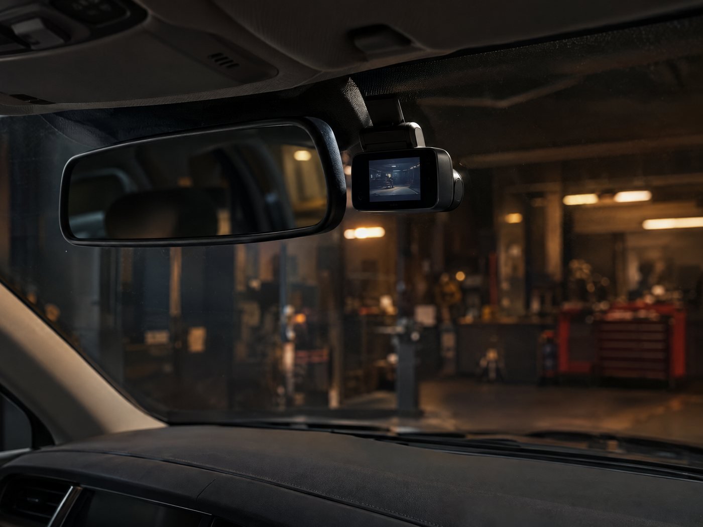 Illustration of a front dashcam mounted neatly behind the rear-view mirror