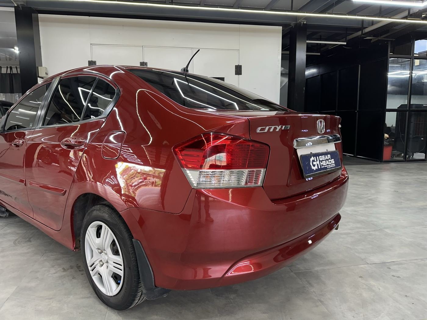 Red Honda City after a full repaint at Gear Heads